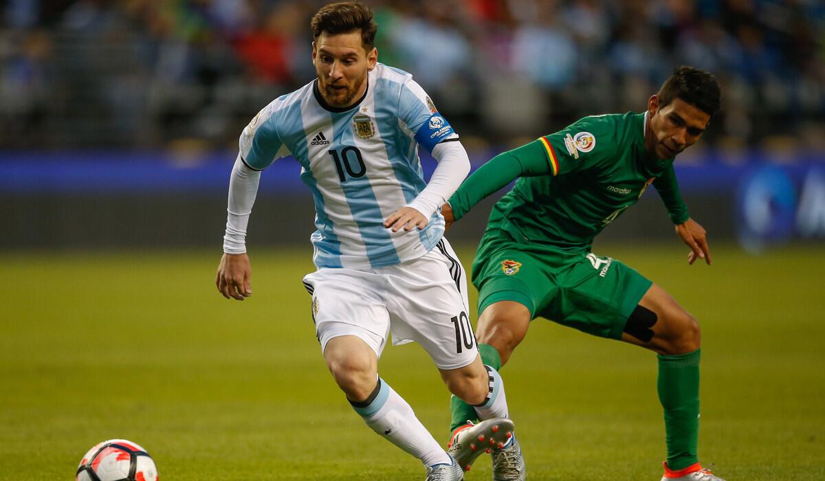 Argentina's Lionel Messi, left, dribbles against Boliva's Danny Bejarano during the 2016 Copa America Centenario Group D match at CenturyLink Field on Tuesday.