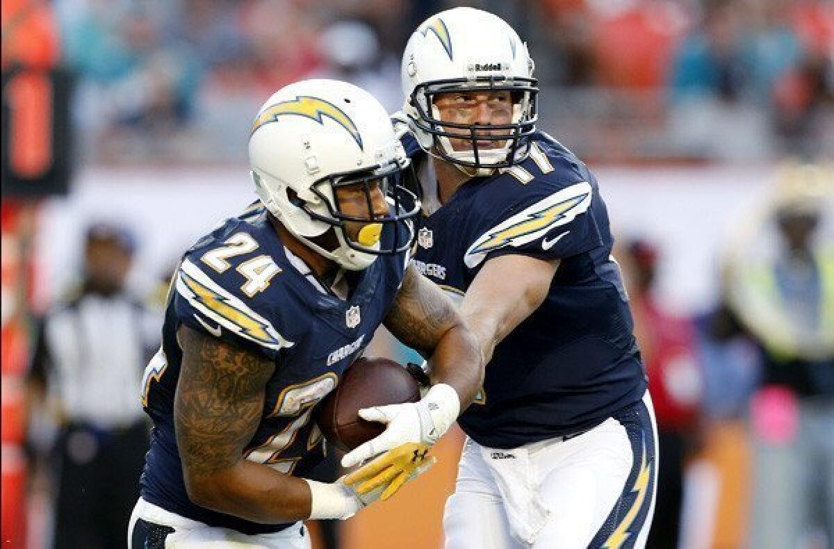 Chargers quarterback Philip Rivers (17), handing off to Ryan Mathews, had his best season, leading the NFL in completion percentage (69.5%) while passing for 4,478 yards with 32 touchdowns and 11 interceptions.
