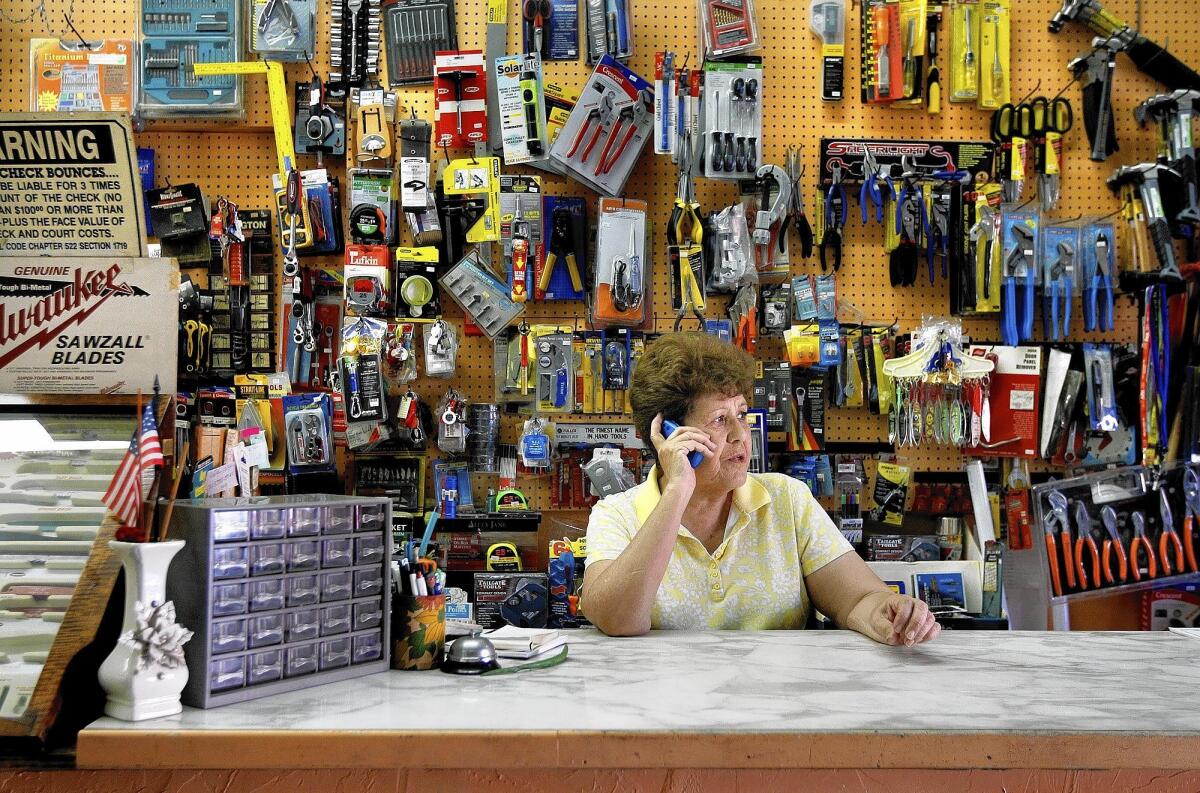 Bertha Wooldridge calls Councilman Gilbert Cedillo's office from her Westlake hardware store to notify them of a problem.