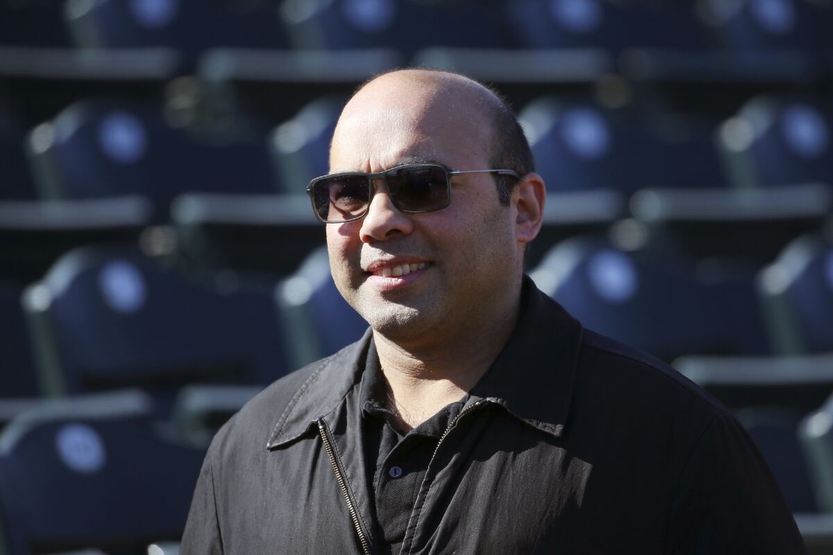 Farhan Zaidi, the San Francisco Giants' president of baseball operations, smiles.