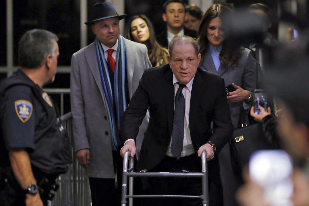 Harvey Weinstein leaves court in New York on Jan. 22. Attorney Donna Rotunno is in the background at right.