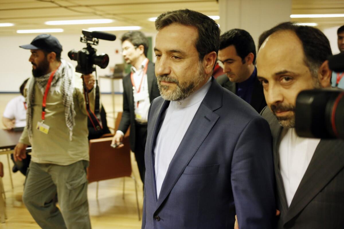 Abbas Araghchi, center, Iran's chief nuclear negotiator, walks with aides and reporters after concluding a round of talks in Vienna on May 16.