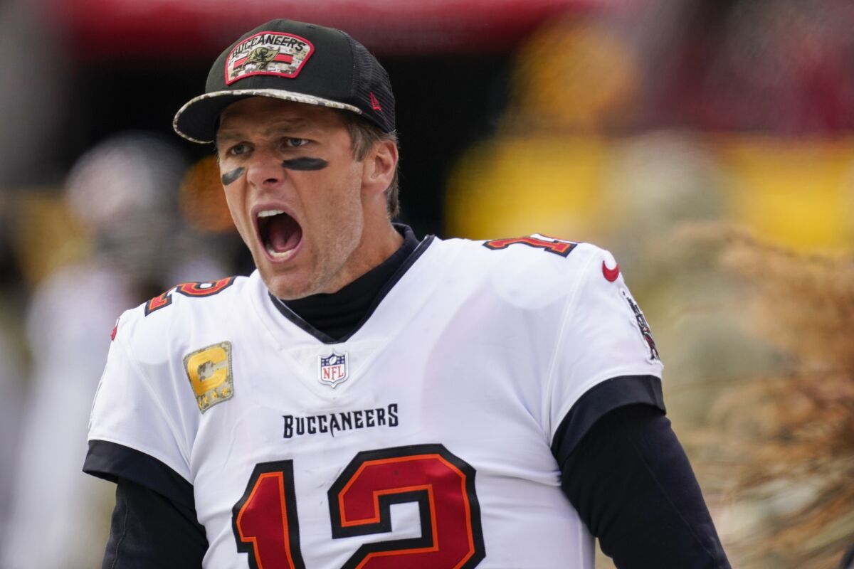 Tampa Bay Buccaneers quarterback Tom Brady yells at his team during the second half of an NFL football game against the Washington Football Team, Sunday, Nov. 14, 2021, in Landover, Md. (AP Photo/Patrick Semansky)
