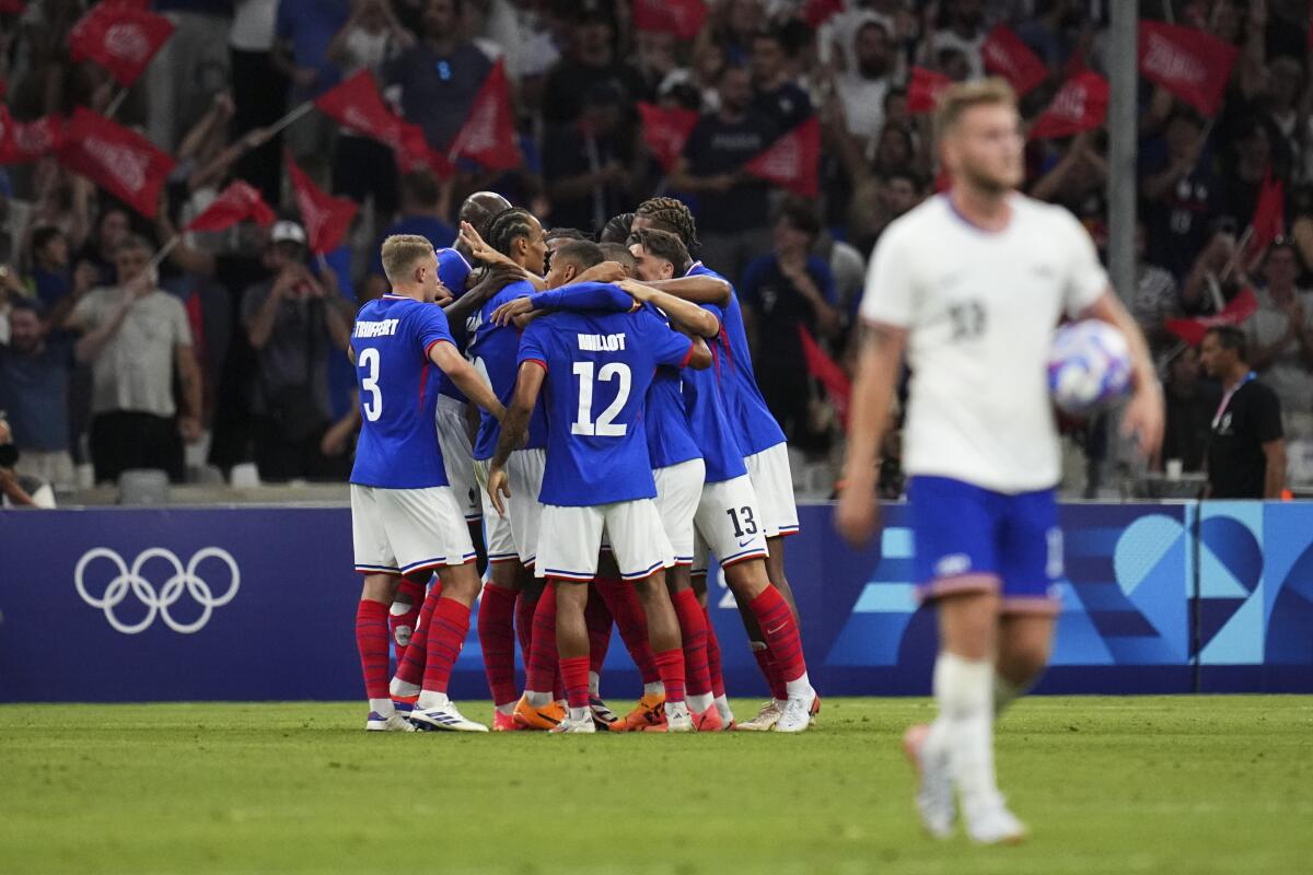 France celebrates after Michael Olise scored the second of three goals against the United States.