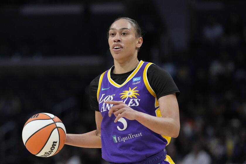 Los Angeles Sparks forward Dearica Hamby (5) controls the ball during a WNBA basketball game.