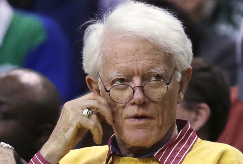 FILE - Former Fidelity Magellan fund manager Peter Lynch is seated during the second quarter of an NBA basketball game in Boston, Wednesday, Feb. 3, 2016. Boston College announced that works of art by Pablo Picasso, Mary Cassatt and Winslow Homer are among 30 pieces of art worth more than $20 million that Lynch, alumnus and legendary investment manager, is donating to Boston College's art museum. (AP Photo/Charles Krupa, File)
