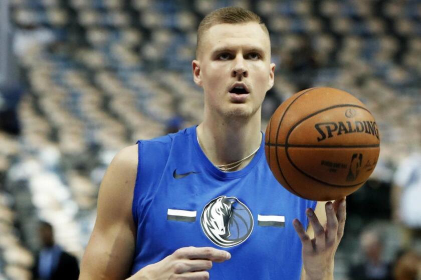 FILE - In this April 3, 2019, file photo, Dallas Mavericks forward Kristaps Porzingis practices before an NBA basketball game against the Minnesota Timberwolves in Dallas. Porzingis was involved in an altercation at a nightclub in his native Latvia. After video showed the 7-foot-3 forward with a bloody forehead, the Mavericks said Sunday, May 12, "It is our understanding that Kristaps was jumped and assaulted outside of a club," without providing further details. (AP Photo/LM Otero, File)