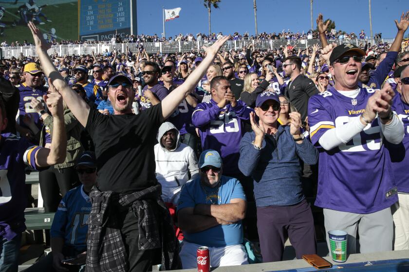 CARSON, CA, SUNDAY, DECEMBER 15, 2019 - Vikings fans cheer after Minnesota Vikings defensive end Ifeadi Odenigbo (95) scooped and scored on a fumble with seconds left in the second quarter at Dignity Health Sports Park. (Robert Gauthier/Los Angeles Times)
