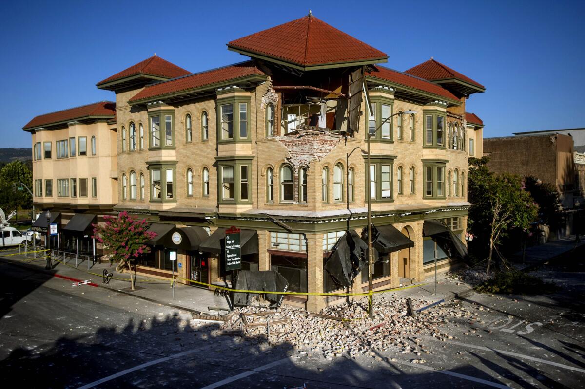 Bricks and debris surround the Alexandria Square building in Napa, Calif., after a 6.0 earthquake on Aug. 24.