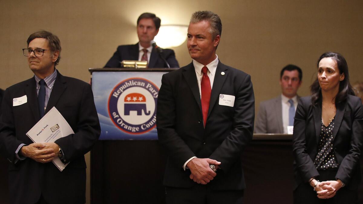 Steve Frank, left, Travis Allen and Jessica Patterson, candidates for California Republican Party chair, attend a meeting of GOP delegates in Costa Mesa last month.