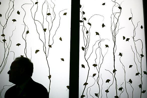 Joe Fleming, senior plant superintendent at UCI Medical Center, stands near an ornate window in the meditation room of the new seven-story hospital. The facility will open this week with 191 beds and gradually expand to 236.