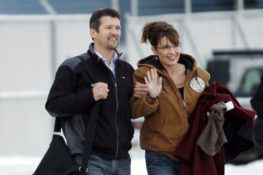 Sarah and Todd Palin walk to a plane at Ted Stevens Anchorage International Airport in 2008. That year, Sarah Palin, Alaska's governor, became the Republican vice presidential nominee.