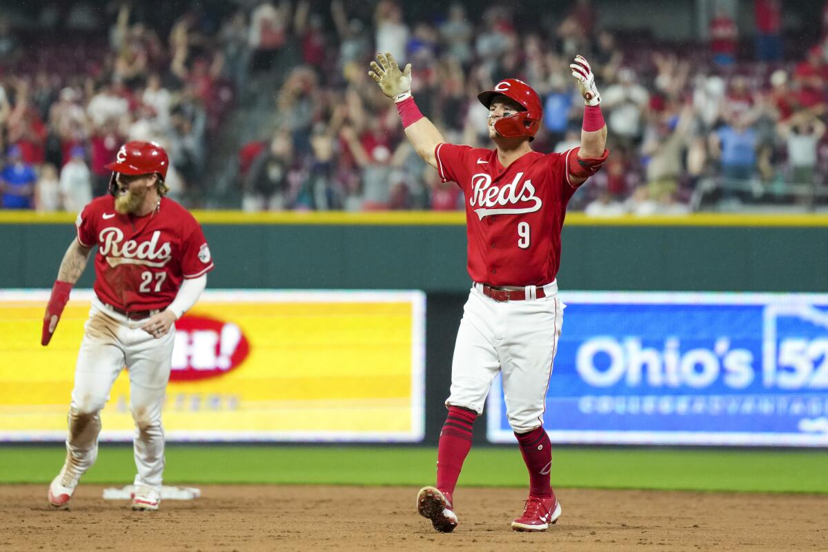 The Reds' Matt McLain celebrates after driving in the winning run with a single against the Dodgers.