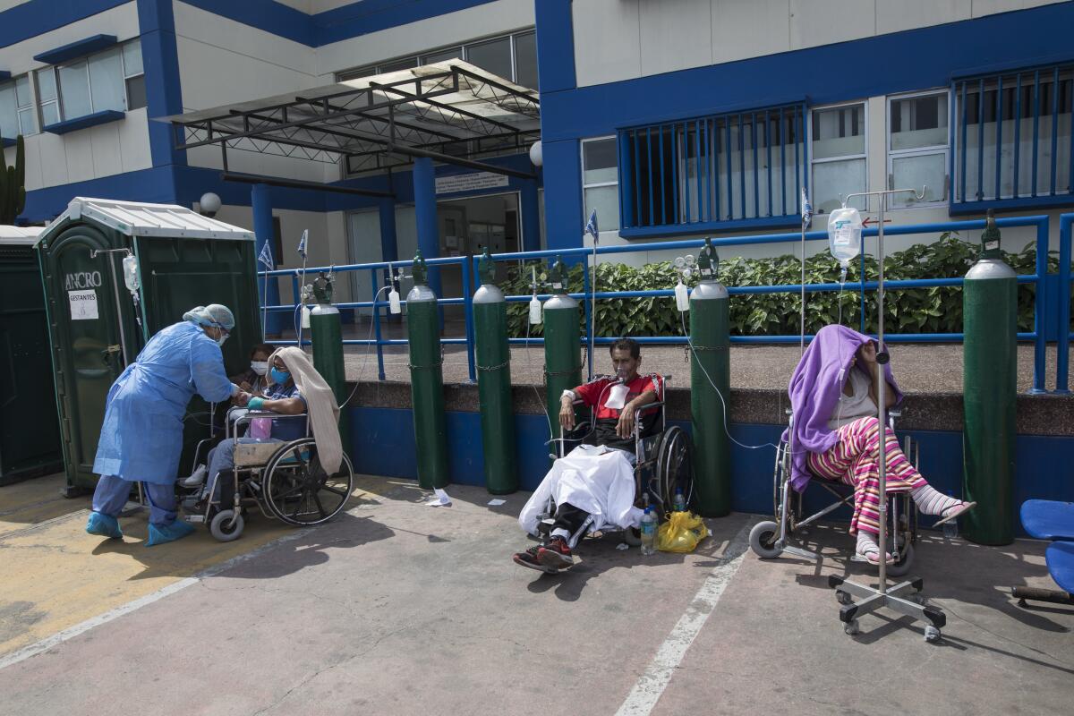 People infected with COVID-19 wait for a hospital bed