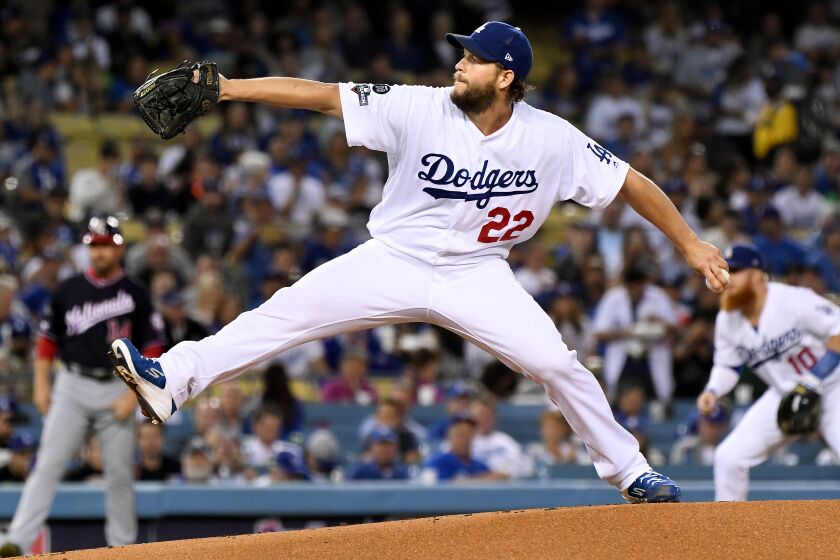 LOS ANGELES, CALIFORNIA OCTOBER 4, 2019-Dodgers pitcher Clayton Kershaw throws a pitch against the NAtionals in the 1st inning in Game 2 of the NLDS at Dodger Stadium Thursday. (Wally Skalij/Los Angeles Times)