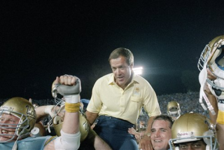 UCLA coach Terry Donahue is carried off the field following his 100th win as Bruins coach.