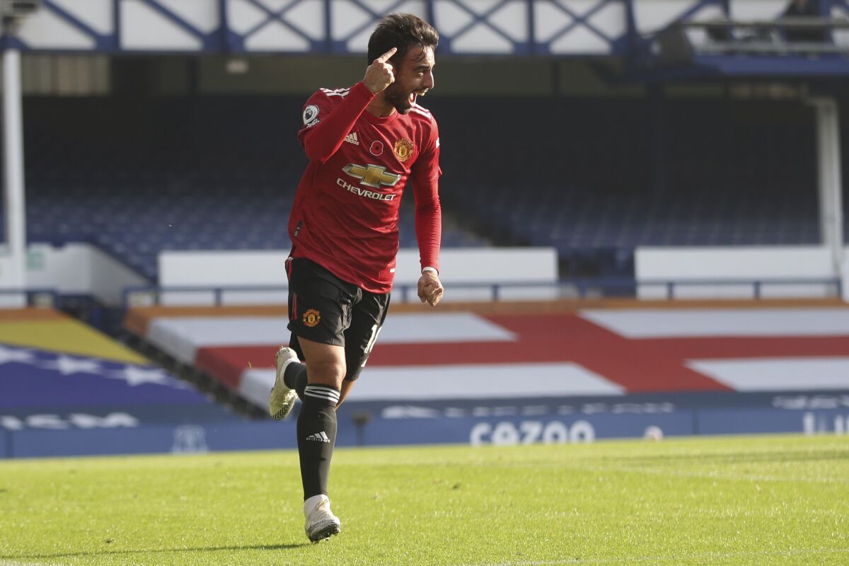 Manchester United's Bruno Fernandes celebrates after scoring his side's opening goal during the English Premier League soccer match between Everton and Manchester United at the Goodison Park stadium in Liverpool, England, Saturday, Nov. 7, 2020. (Carl Recine/Pool via AP)