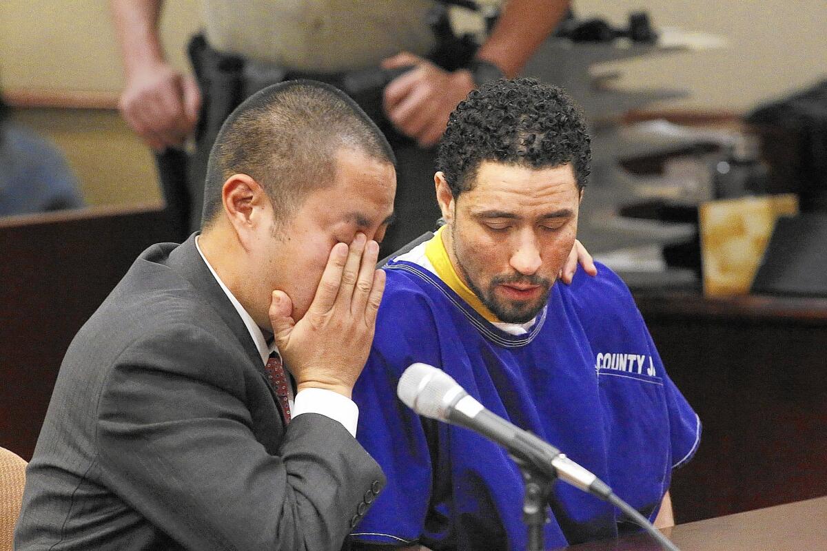 Defense attorney Al Kim, left, and Alex Jackson listen as Vincent Jackson, not pictured, pleads for leniency for his brother.