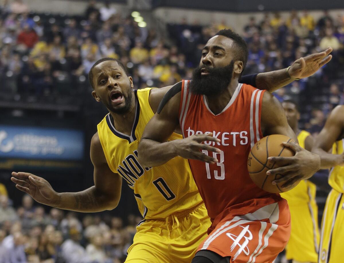 Rockets shooting guard James Harden goes to the basket by Pacers guard C.J. Miles during the first half. Harden finished with 44 points in the Rockets' 110-100 win.