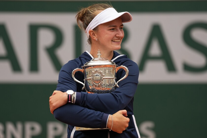 Czech Republic's Barbora Krejcikova holds her trophy after defeating Russia's Anastasia Pavlyuchenkova in their final match of the French Open tennis tournament at the Roland Garros stadium Saturday, June 12, 2021 in Paris. The unseeded Czech player defeated Anastasia Pavlyuchenkova 6-1, 2-6, 6-4 in the final. (AP Photo/Michel Euler)