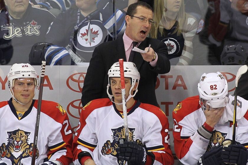 WINNIPEG, CANADA - JANUARY 21: Head coach Kevin Dineen of the Florida Panthers gives instructions from the bench during a game against the Winnipeg Jets in NHL action at the MTS Centre on January 21, 2012 in Winnipeg, Manitoba, Canada. (Photo by Marianne Helm/Getty Images) ORG XMIT: 119008178