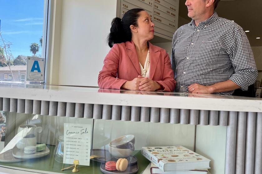 Melanie Dunn and Axel Schwarz, owners of Patisserie Melanie, in front of their restaurant and bakery in North Park.  