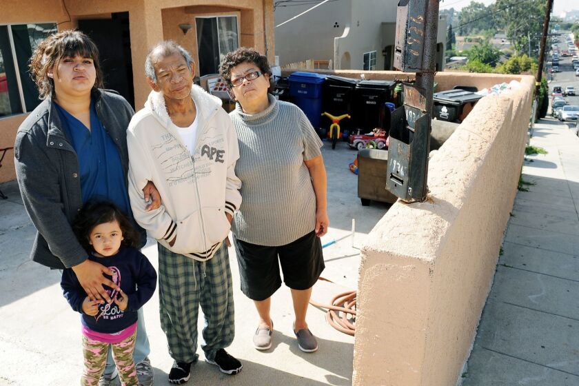 LOS ANGELES-CA-MARCH 10, 2015: Rocio Sanchez, left, with her daughter Annmarie Ganci, 3, and parents Jose Sanchez, center, and Ana Sanchez, right, are photographed at their home in Echo Park on Monday, March 15, 2015. The family is being evicted after living in the neighborhood for 32 years due to gentrification. (Christina House / For The Times)