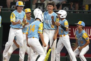 El Segundo's Brody Brooks (14) crosses home plate after hitting a two-run home run.