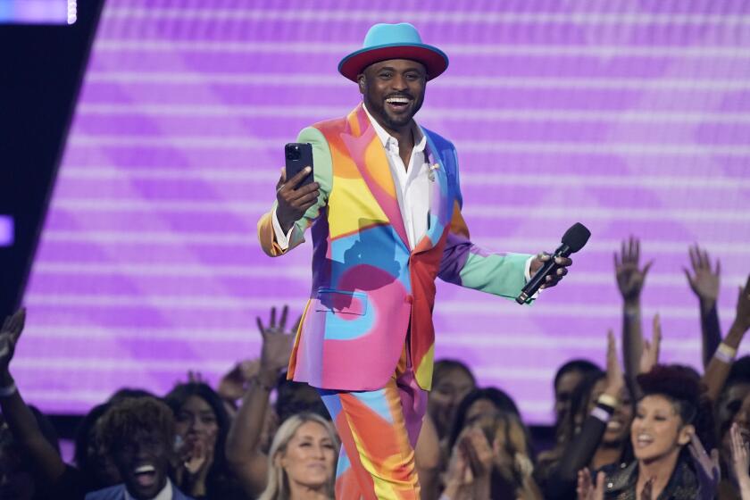 Host Wayne Brady is seen onstage at the American Music Awards on Sunday, Nov. 20, 2022, at the Microsoft Theater in Los Angeles. (AP Photo/Chris Pizzello)