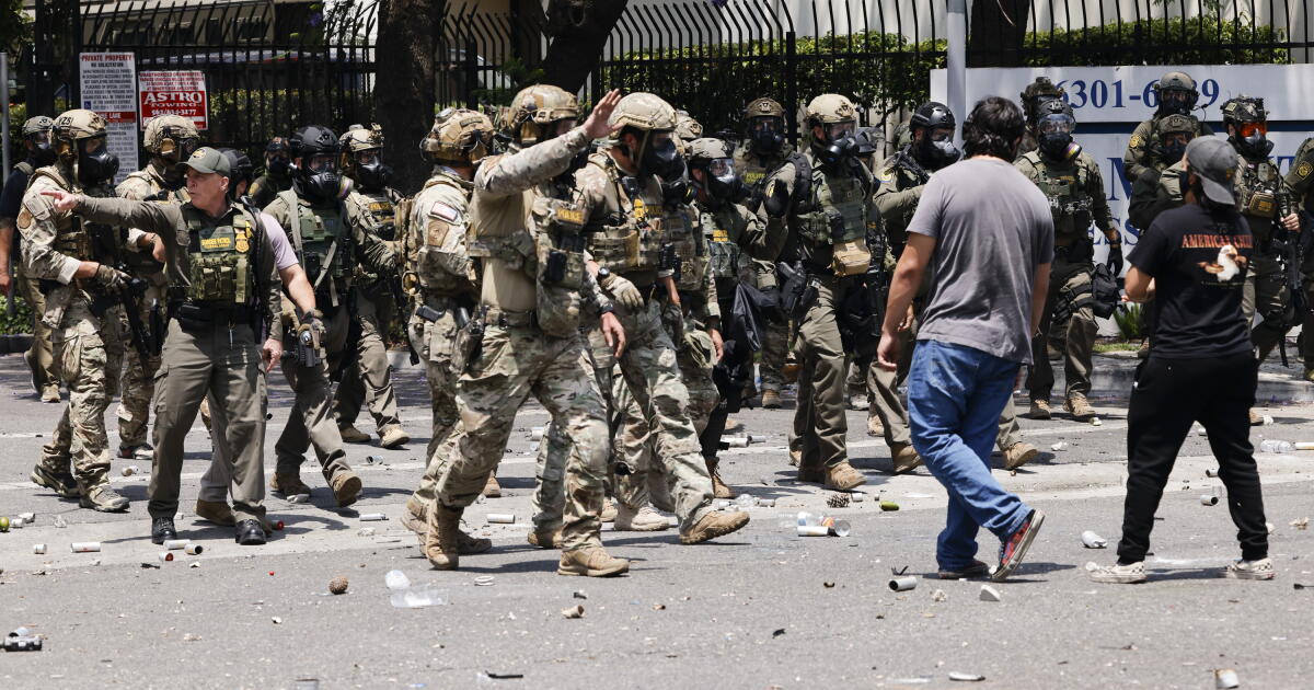 Photo: latimes.com Los Angeles, CA - June 07: ICE officers disperse anti-ICE protesters on E Alondra Blvd. on Saturday, June 7, 2025 in Los