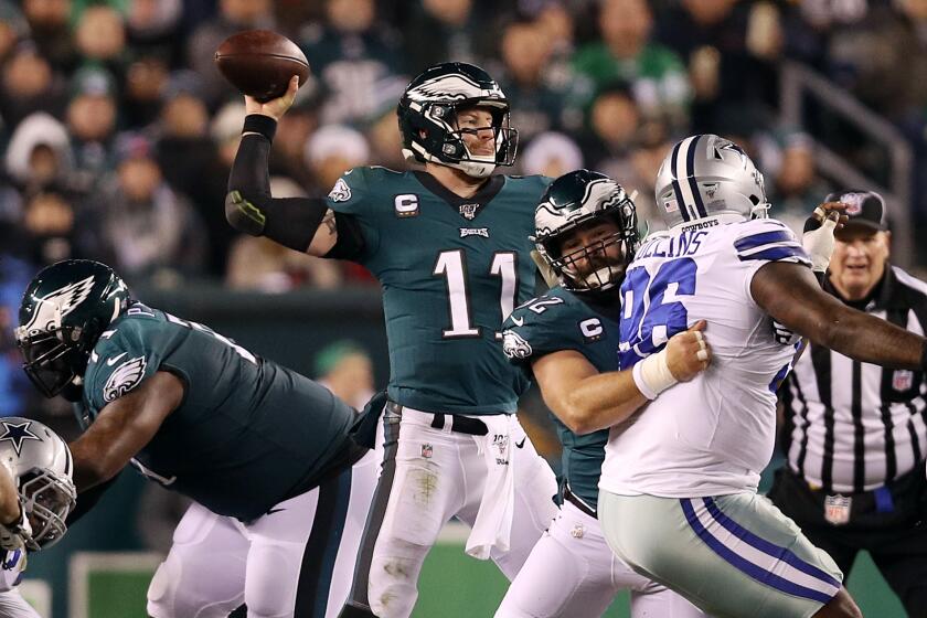 PHILADELPHIA, PENNSYLVANIA - DECEMBER 22: Carson Wentz #11 of the Philadelphia Eagles throws a pass during the first half against the Dallas Cowboys in the game at Lincoln Financial Field on December 22, 2019 in Philadelphia, Pennsylvania. (Photo by Patrick Smith/Getty Images)