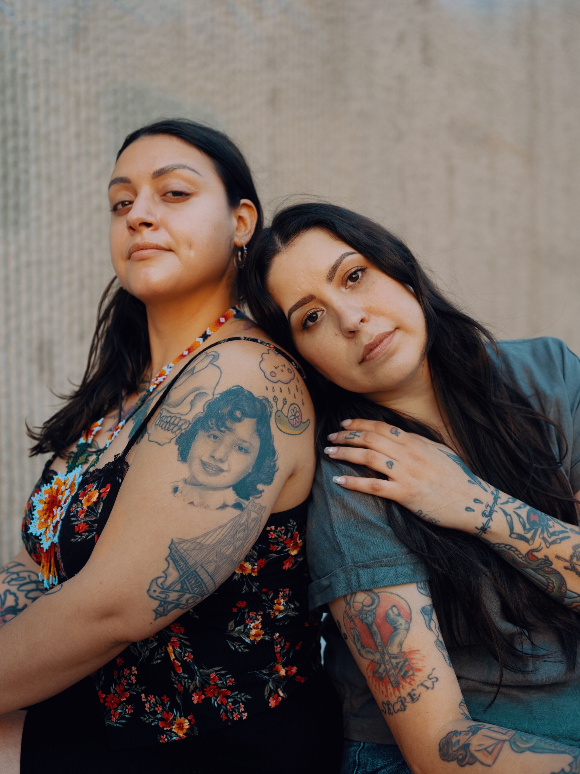 Last year, Artist Arlene Salinas, right, tattooed a portrait of Anna Garray Enguidanos’ grandma Rosie Garay as a pre-teen.