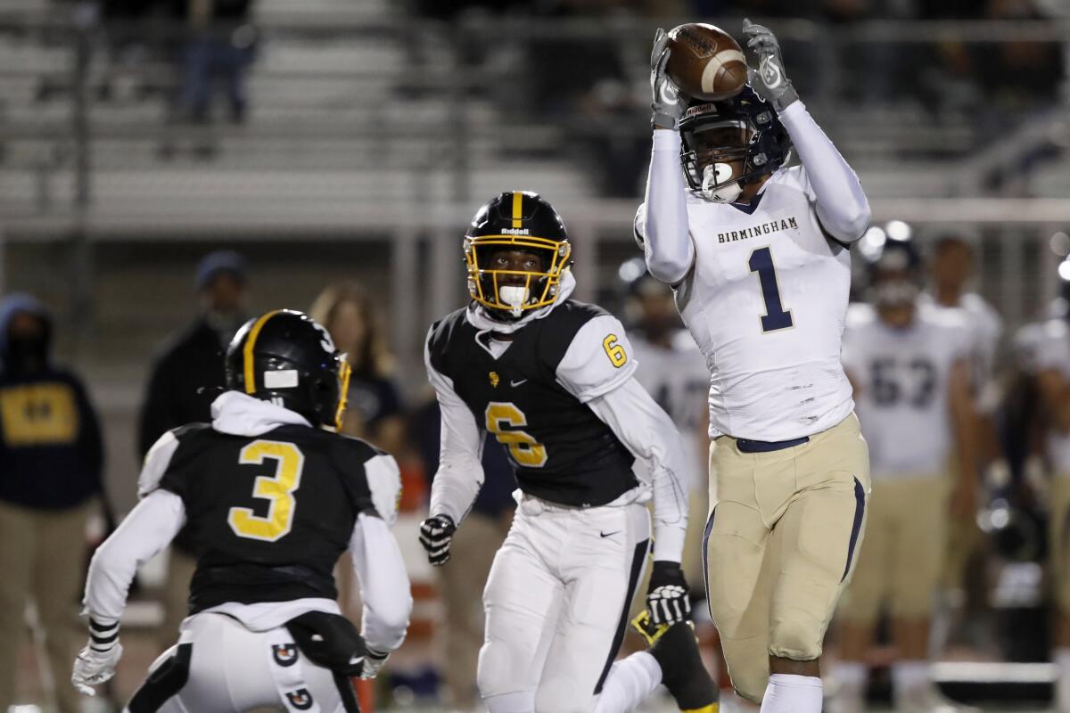 Lake Balboa Birmingham wide receiver Arlis Boardingham (1) catches a pass and runs for a touchdown.