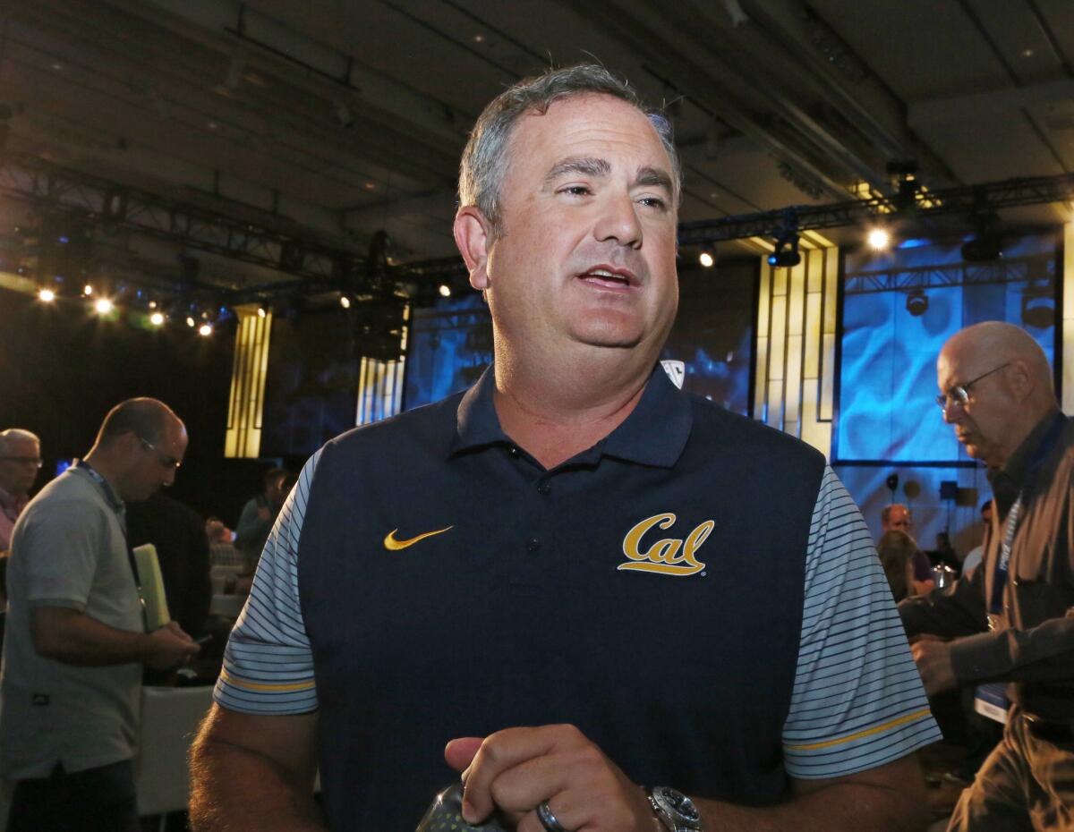 California Coach Sonny Dykes talks to reporters.