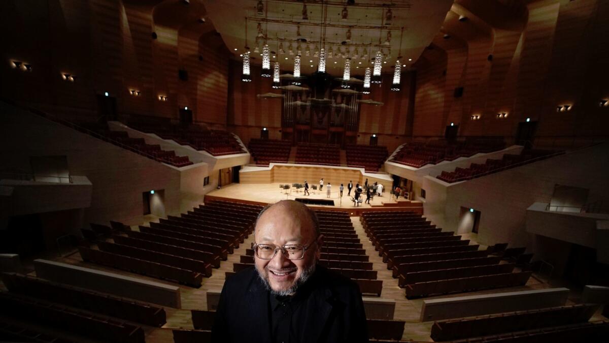 Japanese acoustician Yasuhisa Toyota speaks during an interview at Suntory Hall in Tokyo.