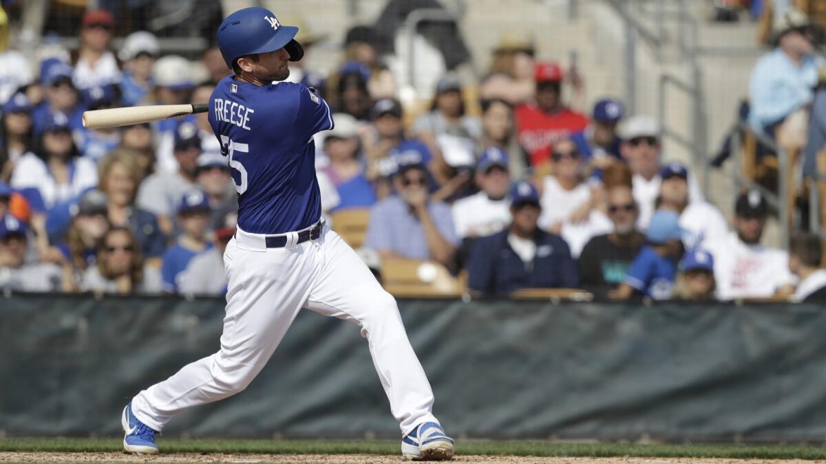 Dodgers' David Freese hits during a spring training game in Glendale, Ariz.