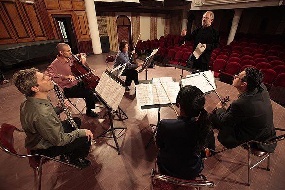 Jeff von der Schmidt, artistic director of the Southwest Chamber Music, and musicians rehearse at the Vietnam National Academy of Music in Hanoi.