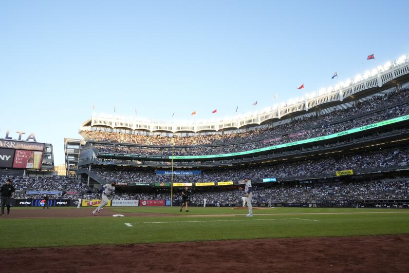 Los Angeles Dodgers' Teoscar Hernández runs the bases after hitting a home run during the second inning of a baseball game against the New York Yankees, Saturday, June 8, 2024, in New York. (AP Photo/Frank Franklin II)