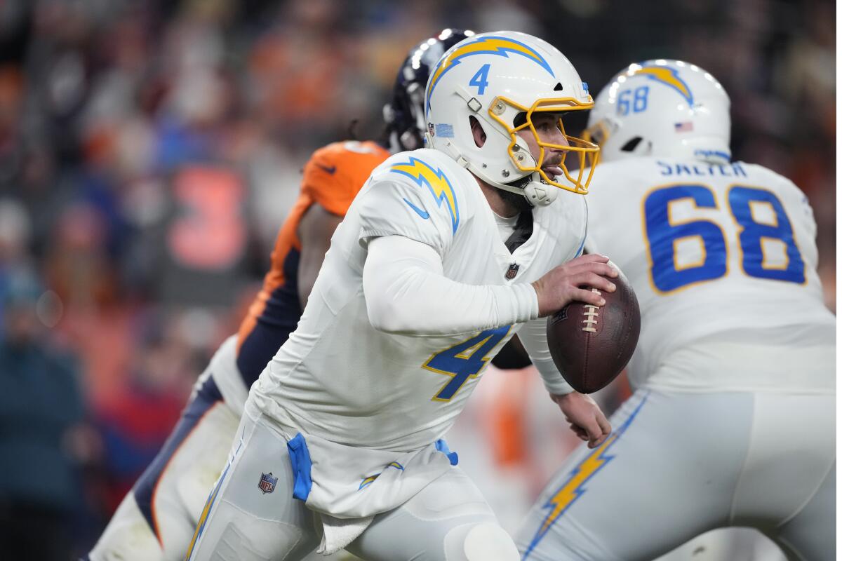 Chargers quarterback Chase Daniel (4) scrambles against Denver.