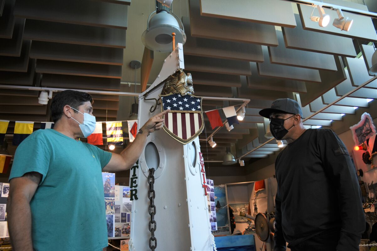 Navy veterans Joe Frangiosa, left, and Julian Ospina discuss coping with PTSD at the Bonita Museum and Cultural Center.