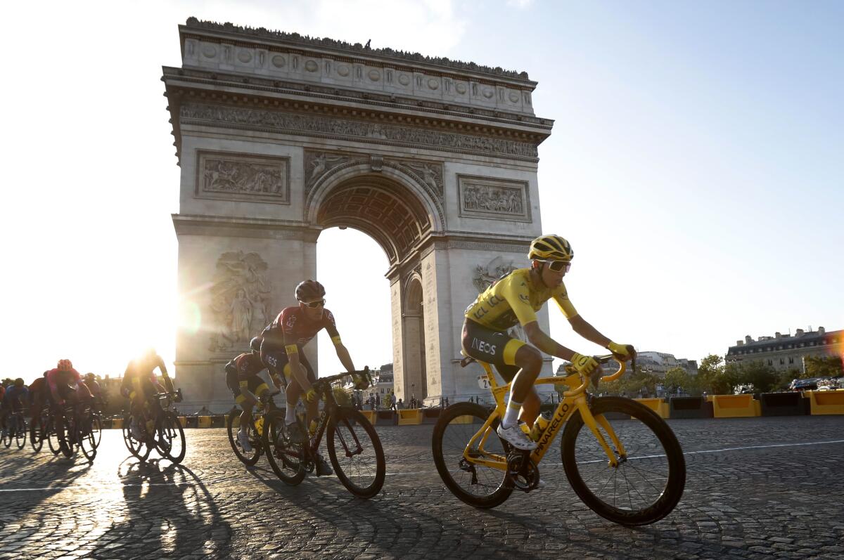 Egan Bernal rides past the Arc de Triomphe in Paris during the final stage of the Tour de France on Sunday.