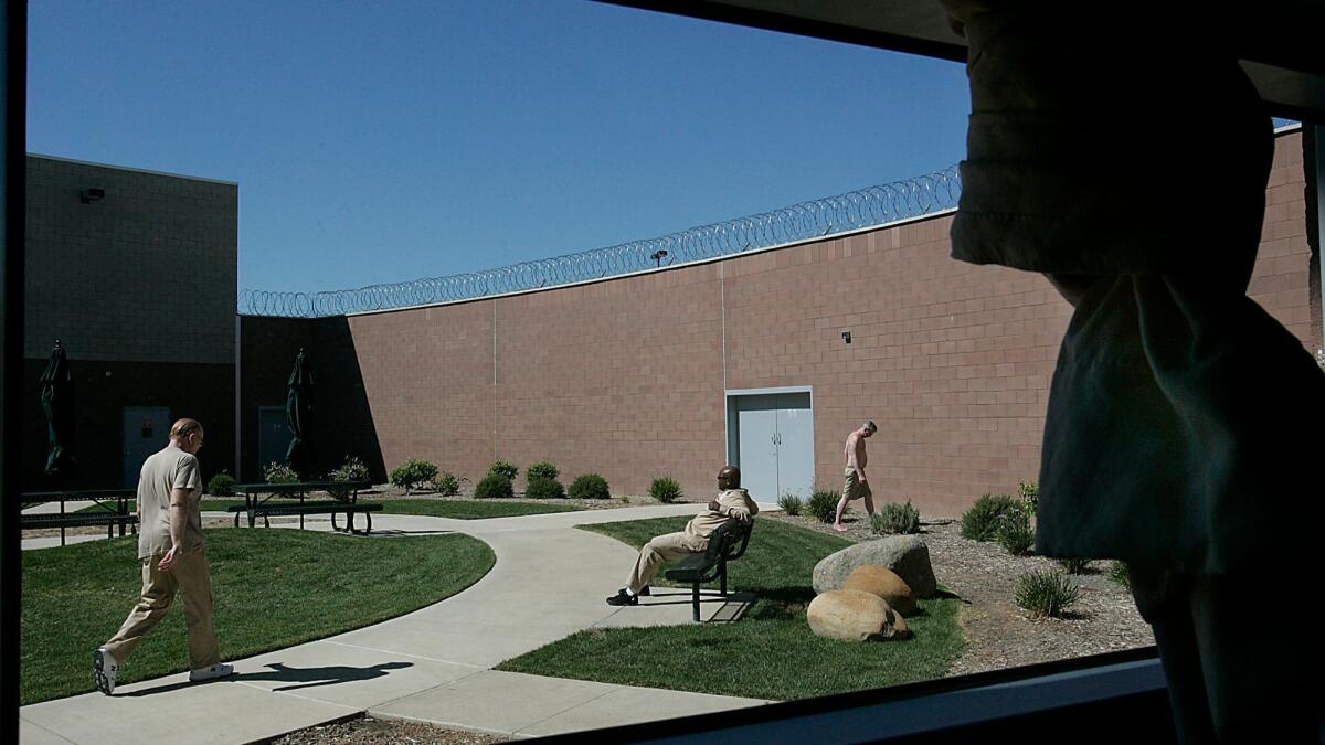 Patients use one of the outdoor courtyards during a lunch break at Coalinga State Hospital.