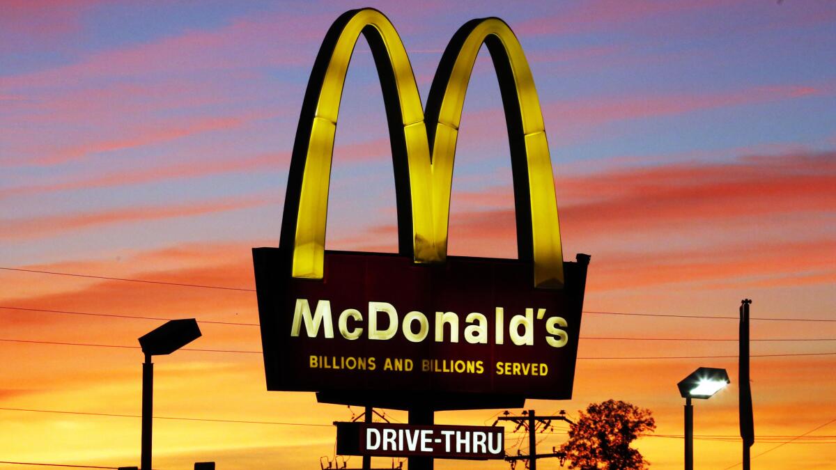 McDonald's will serve up books with its Happy Meals for the next two weeks.