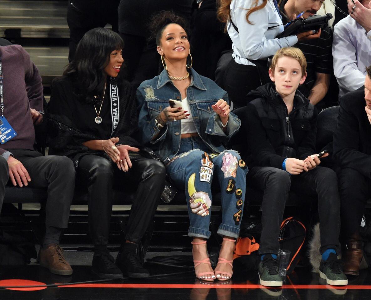 Rihanna watches the NBA All-Star game from a courtside seat at Madison Square Garden on Sunday.