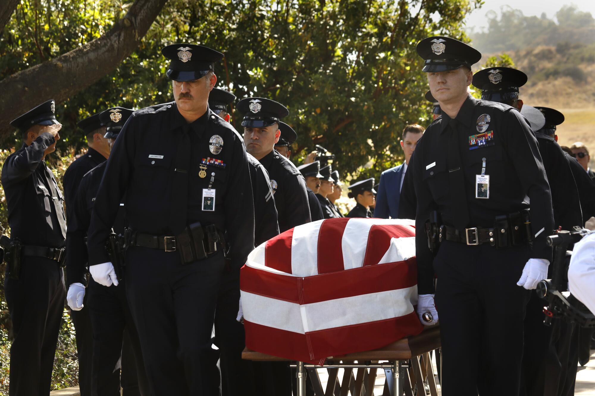 LAPD officers carry the casket of  Officer Houston R. Tipping 