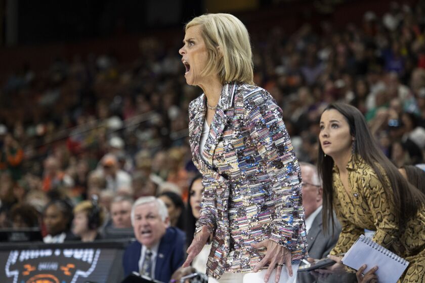 LSU head coach Kim Mulkey yells during the first half of an Elite 8 college basketball game against Miami in the NCAA Tournament in Greenville, S.C., Sunday, March 26, 2023. (AP Photo/Mic Smith)