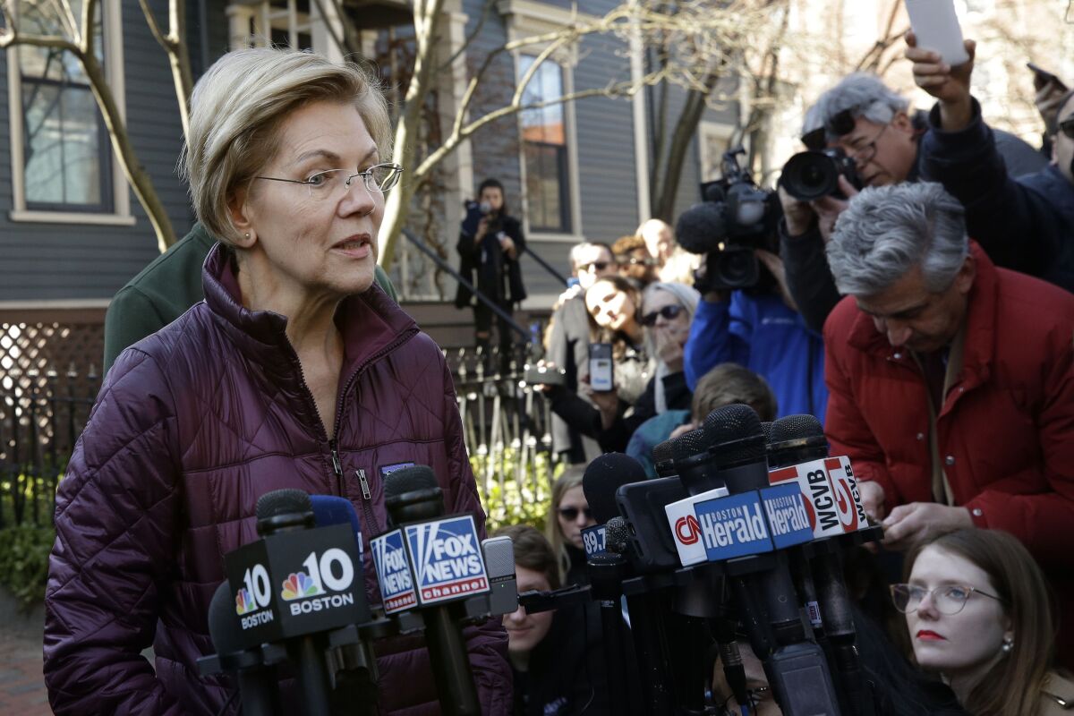 Sen. Elizabeth Warren speaks to reporters in 2020. 