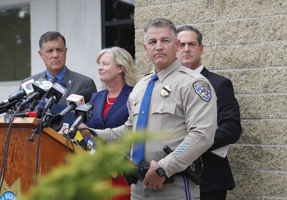 CHP assistant chief Don Goodbrand answers questions at a press conference.