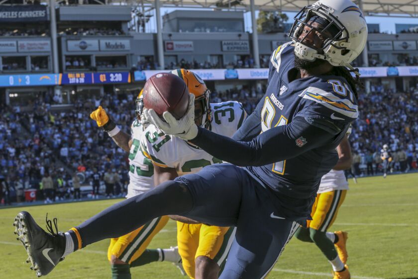 CARSON, CA, SUNDAY, NOVEMBER 3, 2019 - Los Angeles Chargers wide receiver Mike Williams (81) is shoved out of bounds by Green Bay Packers strong safety Adrian Amos (31) after a long catch and run play in the second half at Dignity Health Sports Park. (Robert Gauthier/Los Angeles Times)