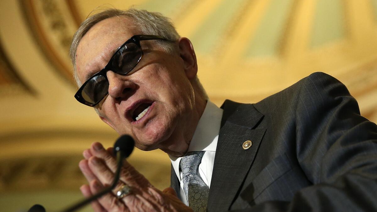 Senate Minority Leader Harry Reid (D-Nev.) answers reporters' questions at the U.S. Capitol on May 5, 2015.